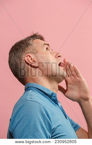 Secret, Gossip Concept. Young Man Whispering A Secret Behind His Hand. Businessman Isolated On Trend