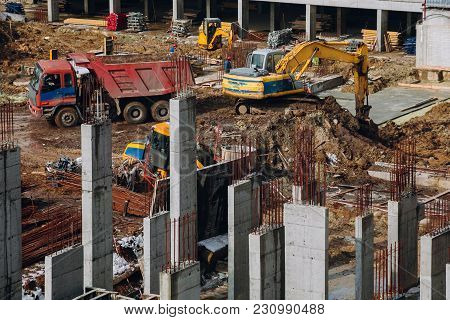 Machinery And Bulldozer With Ground And Beam At Building Contstruction Site On Background Of Dirty G