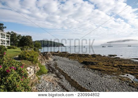 View From The Walking Path That Runs Along The Coast In Bar Harbor With Fog Covering Porcupine Islan