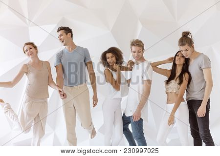 Group Of Young Multi-ethnic Beautiful People Wearing Casual Clothes Smiling And Having Fun Together 