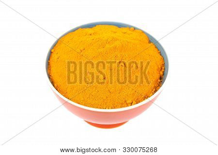 Turmeric Powder (curcuma) In Brown Bowl On White Background. Herbal
