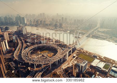 Shanghai Nanpu Bridge over Huangpu River with busy traffic in China.