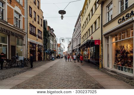 Stralsund, Germany - July 31, 2019: Scenic View Of Commercial Street With Unidentified People In The