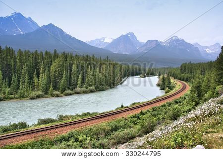 Canada Railway Line Along Bow River In Banff National Park. Province Of Alberta.