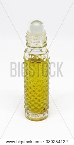Attar Perfume Isolated In White Background In Mini Bottles