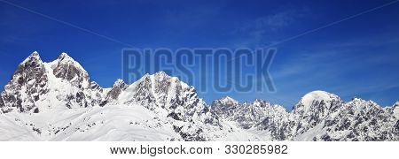 Panoramic View On Snowy Mountains At Sunny Winter Day. Caucasus Mountains. Svaneti Region Of Georgia