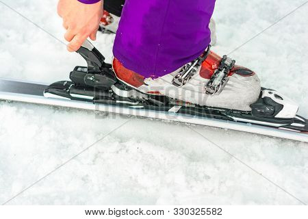 The Athlete Skier Demonstrates A Set Of Skis And Boots On The Leg.