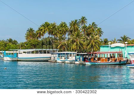 Himmafushi, Maldives - November 18, 2017: Boats Moored To The Transport Pier At Himmafushi Island, M