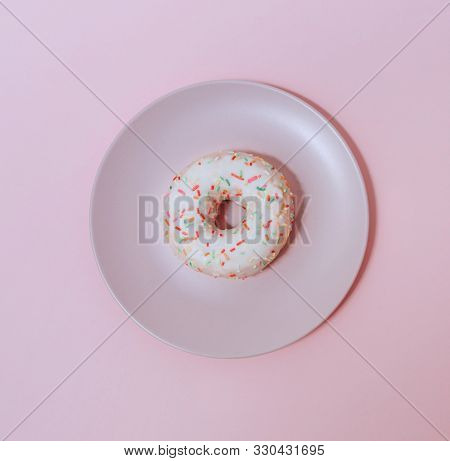 Chocolate Tempting Donut On A Pink Plate On A Pink Table.