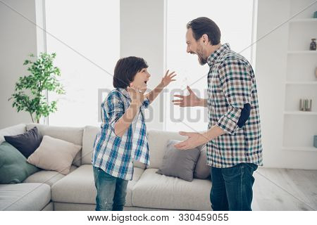 Profile Side View Portrait Of Two Nice Mad Pissed Off Guys Dad And Pre-teen Son In Casual Checked Sh