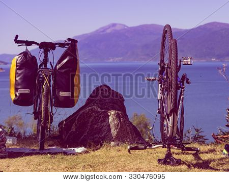 Bike Repair. Mountain Bicycle With Saddlebag Against Nature, Mountains Fjord Landscape In Norway