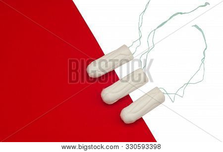 Hygienic White Tampons For Women. Cotton Swab. Menstruation, Protective Equipment. Tampons On A Blac