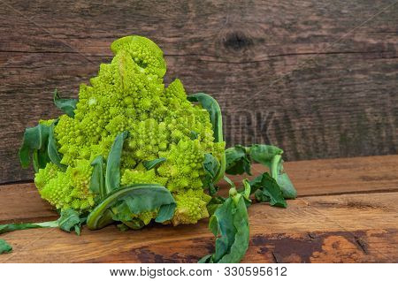Fresh Cabbage Grade Romanesco On A Wooden Background, Close-up