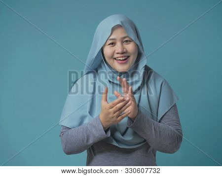 Happy Asian Muslim Woman Wearing Blue Shirt, Happy Proud Clapping Gesture, Halfl Body Portrait