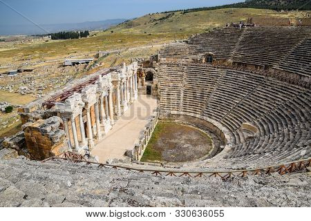Pamukkale, Hierapolis, Turkey - May 22, 2019: Ancient Antique Amphitheater In The City Of Hierapolis