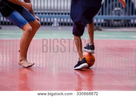 Futsal Players Between Barefoot And Sport Shoes.