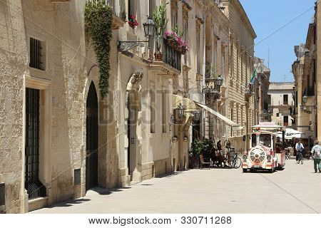 Lecce, Italy - June 1, 2017: People Visit Baroque City Of Lecce, Italy. With 50.7 Million Annual Vis