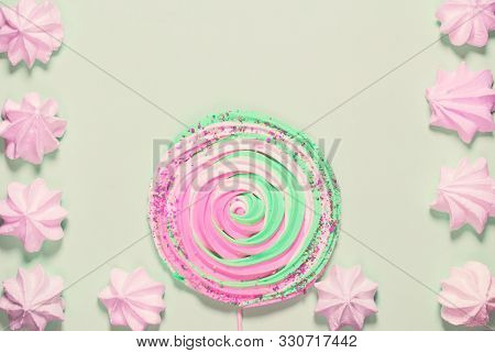 Colorful  Meringues On Pastel Background. Festive And Party Concept. Minimal Style. Flat Lay. Top Vi