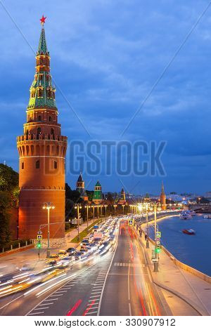 Dusk View Of The Moscow Kremlin, Kremlevskaya Embankment, And The Moskva River, Moscow, Russia