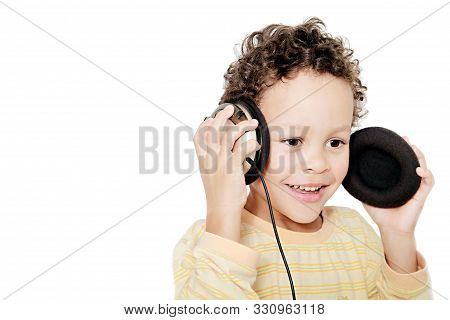 Boy With Headphones Enjoying Music   On White Background Stock Photo
