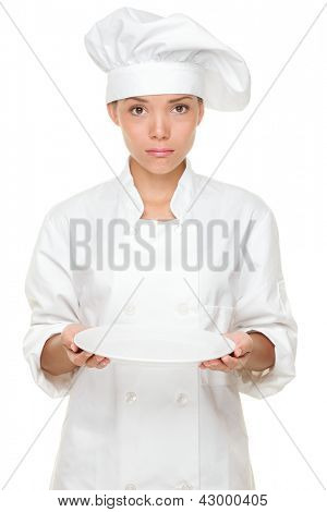 Chef déçu et triste avec assiette vide. Chef femme desservant funn et assiette vide à la recherche négative