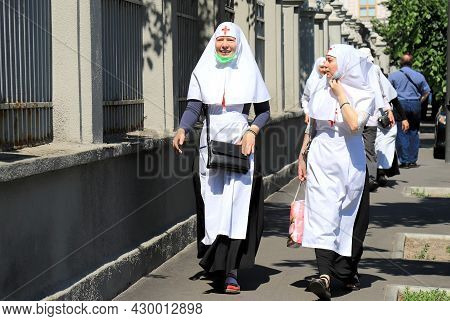 Nuns In Church Robes And Medical Masks Are Walking Along The Streets Of Kiev. Religious Women, Paris