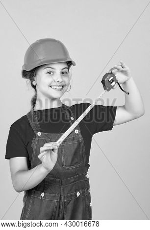 Length. Construction Worker With Tape Measure. Cute Kid As A Construction Worker. Kid Repairing Home