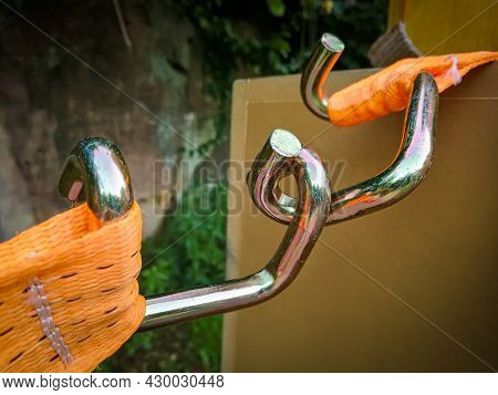 Detail View Of A U-profile Hook At An Orange Ratchet Strap For The Secure Fastening Of Loads