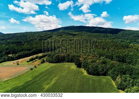 Aerial View Of Beautiful Landscape In Mountains With Forest And Fields. Sleza Mountain Near Wroclaw 