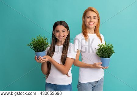 Fostering And Adoption. Happy Adopted Child And Mother Hold Houseplants. Foster Family. Fostering