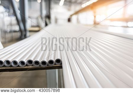 Warehouse Of Polypropylene Pipes. Workshop With Extruders For Producing Plastic Pipes. High Speed Ex