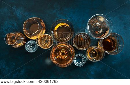 Strong Alcohol Drinks, Hard Liquors, Spirits And Distillates Iset In Glasses: Cognac, Scotch, Whiske