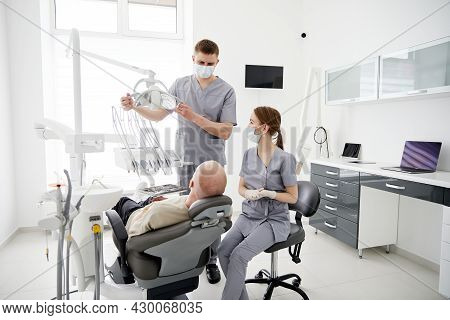 Hospital Two Doctors In Medical Uniform Looking Into Sick Pacient Mouth Analyzing Teeth Health Prepa