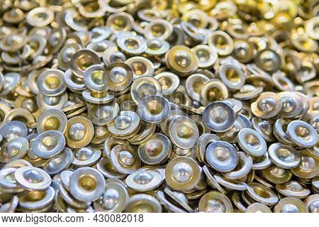 Variety Of Newly Produced Stainless Steel Shiny Washers Placed Together Bulk.