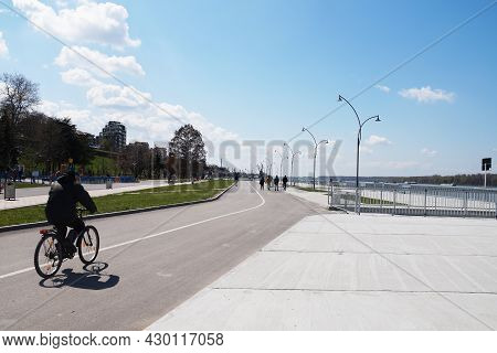 Ruse, Bulgaria - April, 09, 2021: Cyclist On The Embankment Of The Danube River