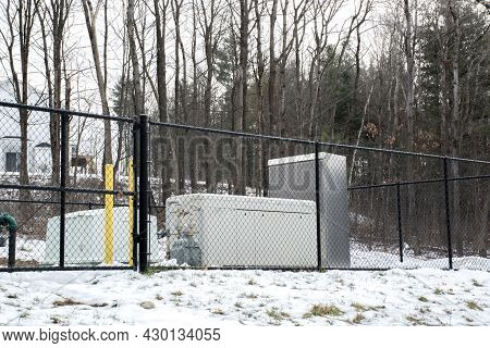 Emergency Generator For Uninterruptible Power Supply Behind Metal Fence