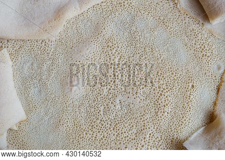 Close Up Image Of Injera, A Fermented Flatbread Made With Teff Flour