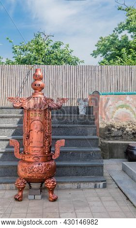 Bronze Gilded Steel Incinerator At Seaside Temple.