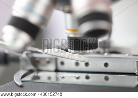 Study Of White Powder In A Laboratory Under Microscope Closeup