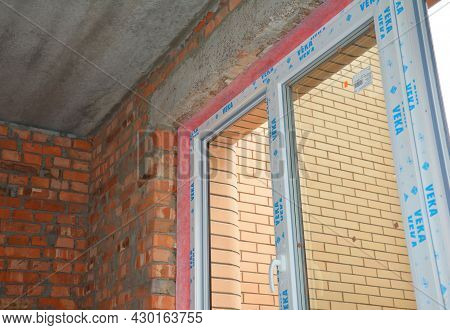 Kyiv, Ukraine - July, 26, 2021: A Close-up Of A Window Installation In A New Brick House Using Shims