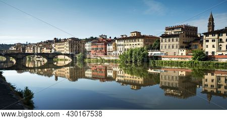 Panoramic View Of The City Of Florence On The Banks Of The Arno River With The Reflection Of The Col