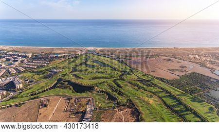 Green Golf Courses By The Sea. Salgados Beach. Portugal, Albufeira. Aerial View.