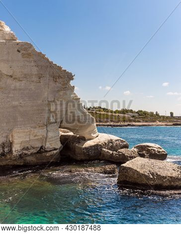 Karst cave in the limestone mountain Rosh a Nikra. Magnificent color of sea water - from turquoise to dark blue. Israel. The concept of active, eco and photo tourism