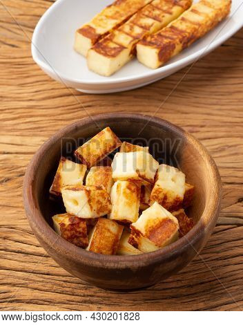 Grilled Rennet Or Coalho Cheese On A Wooden Bowl.