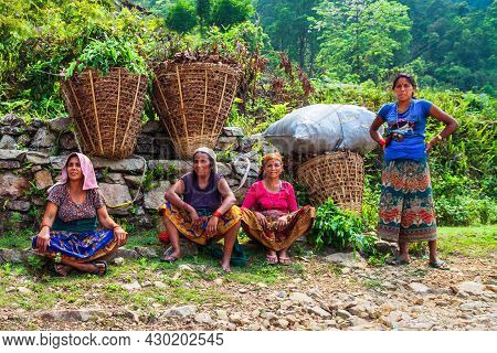 Pokhara, Nepal - May 26, 2012: Unidentified Nepalese Women Farmers Have A Rest After Working In A Ri