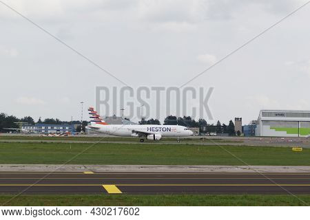 A Heston Airlines Plane Has Landed At Riga International Airport. The Plane On The Runway. Riga Inte