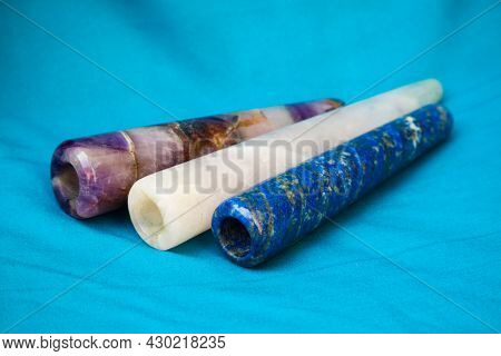 Clay Chillum For Marijuana Smoking On A Blue Fabric Background