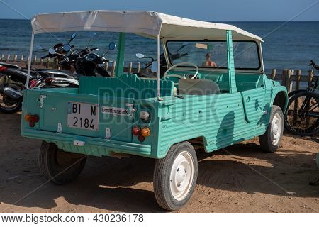 Formentera, Spain: 2021 August 17: Retro Citroen Mehari In Light Blue And White On Mijorn Beach In F