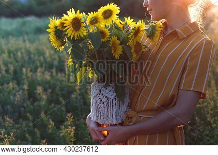 Girl And Sunflowers