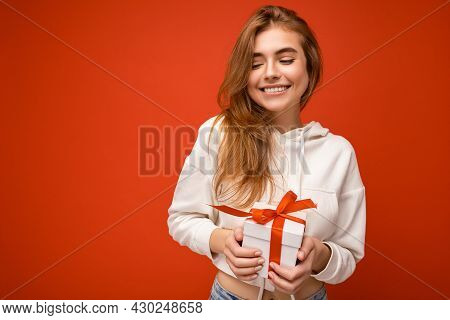 Photo Shot Of Charming Happy Joyful Smiling Blonde Young Woman Isolated Over Colorful Background Wal